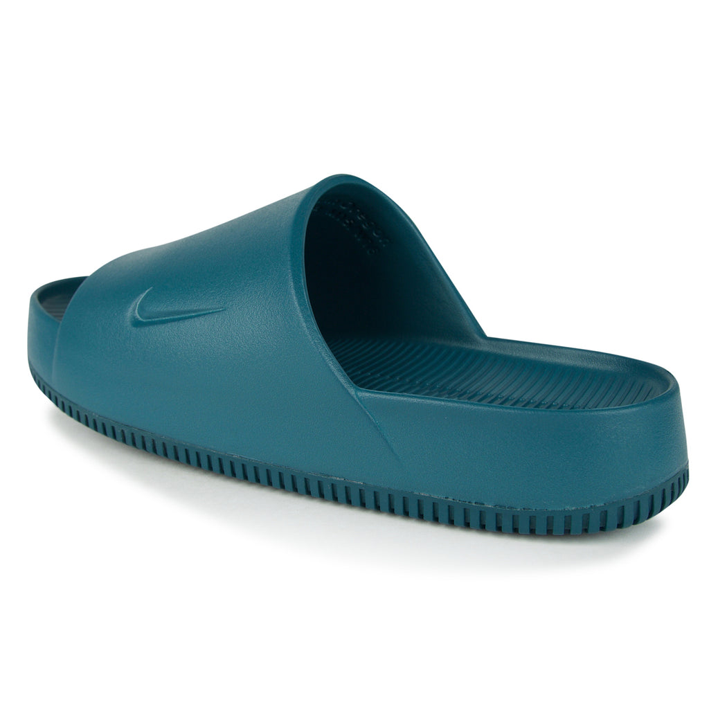 white and teal nike slides